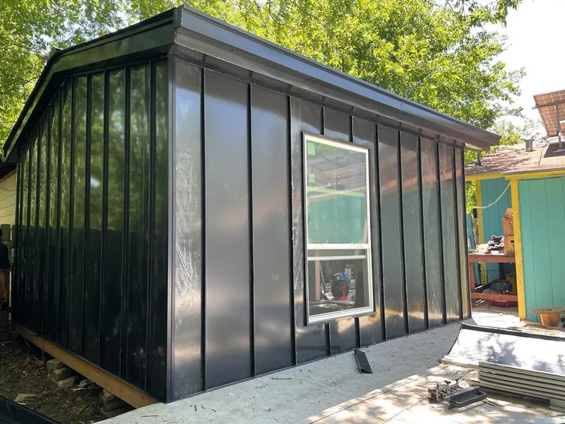 Black standing seam metal wall panels for Roof Inspection in North Smithfield